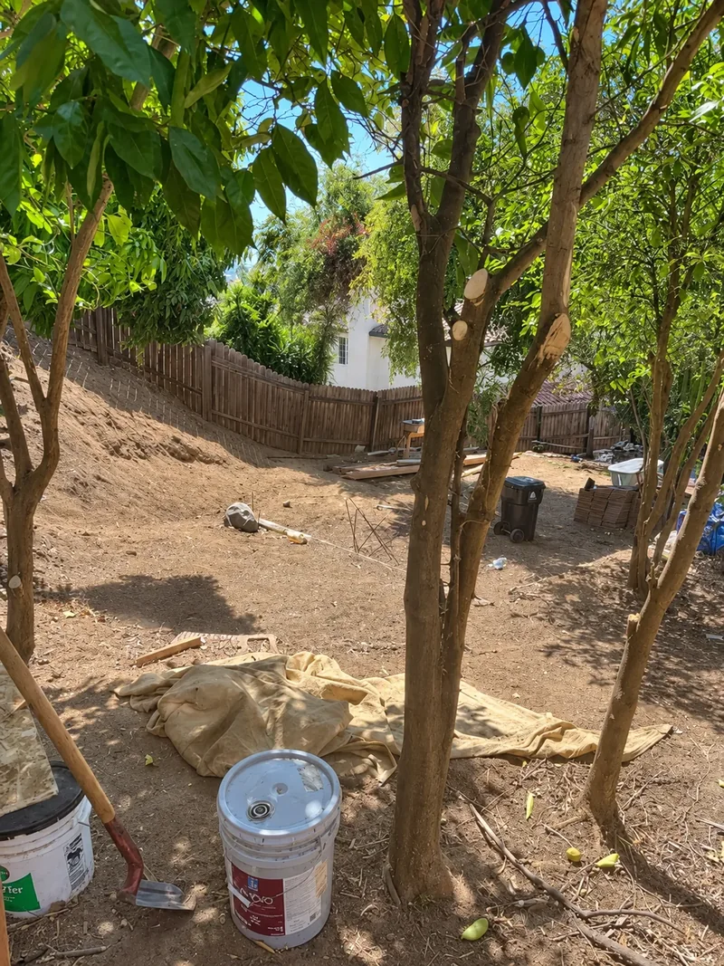 Backyard landscape work in progress during construction of the proposed outdoor retreat.